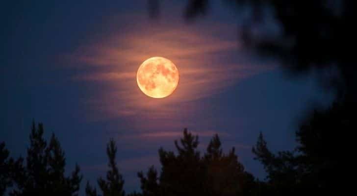 The Beaver Moon with a few clouds in front of it