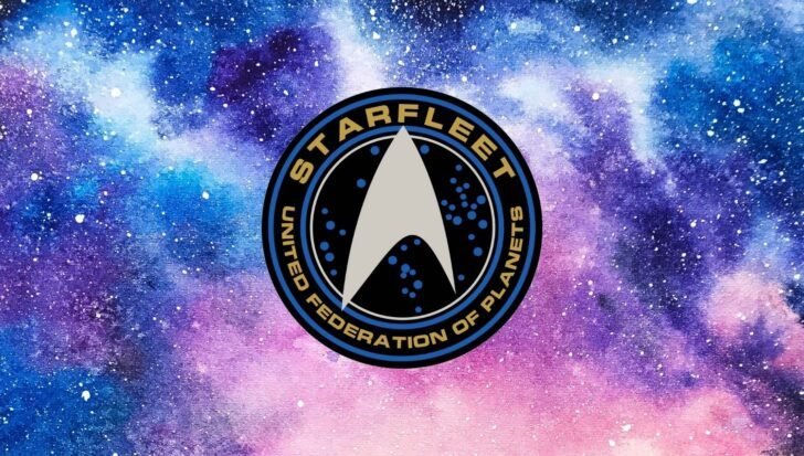 Starfleet emblem against a colorful galaxy background