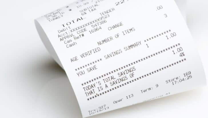 Close-up of a paper shopping receipt with printed text and numbers