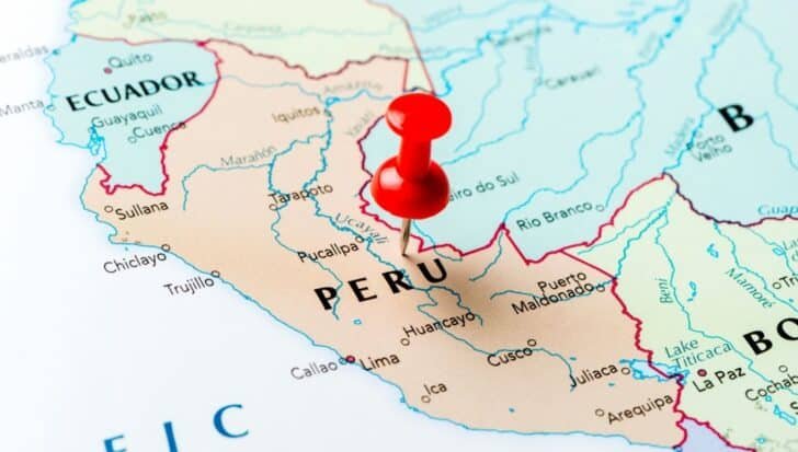 Map highlighting Peru pinned with a red pushpin, showing neighboring countries Ecuador and Bolivia