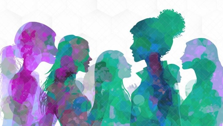 Colorful silhouettes of diverse women profiles facing each other against a light background